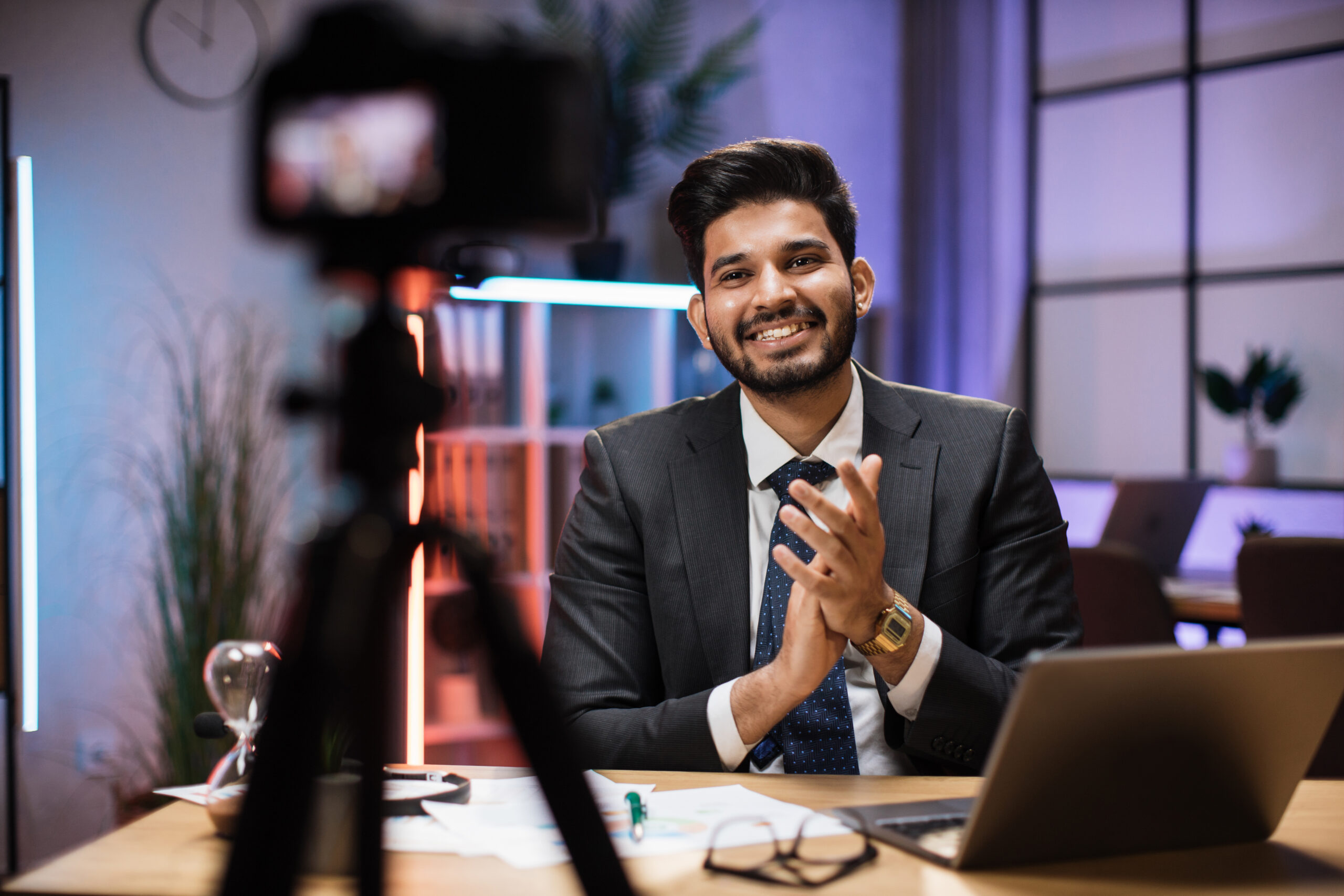 Arab skilled bearded businessman in formal wear recording new video for his internet business course
